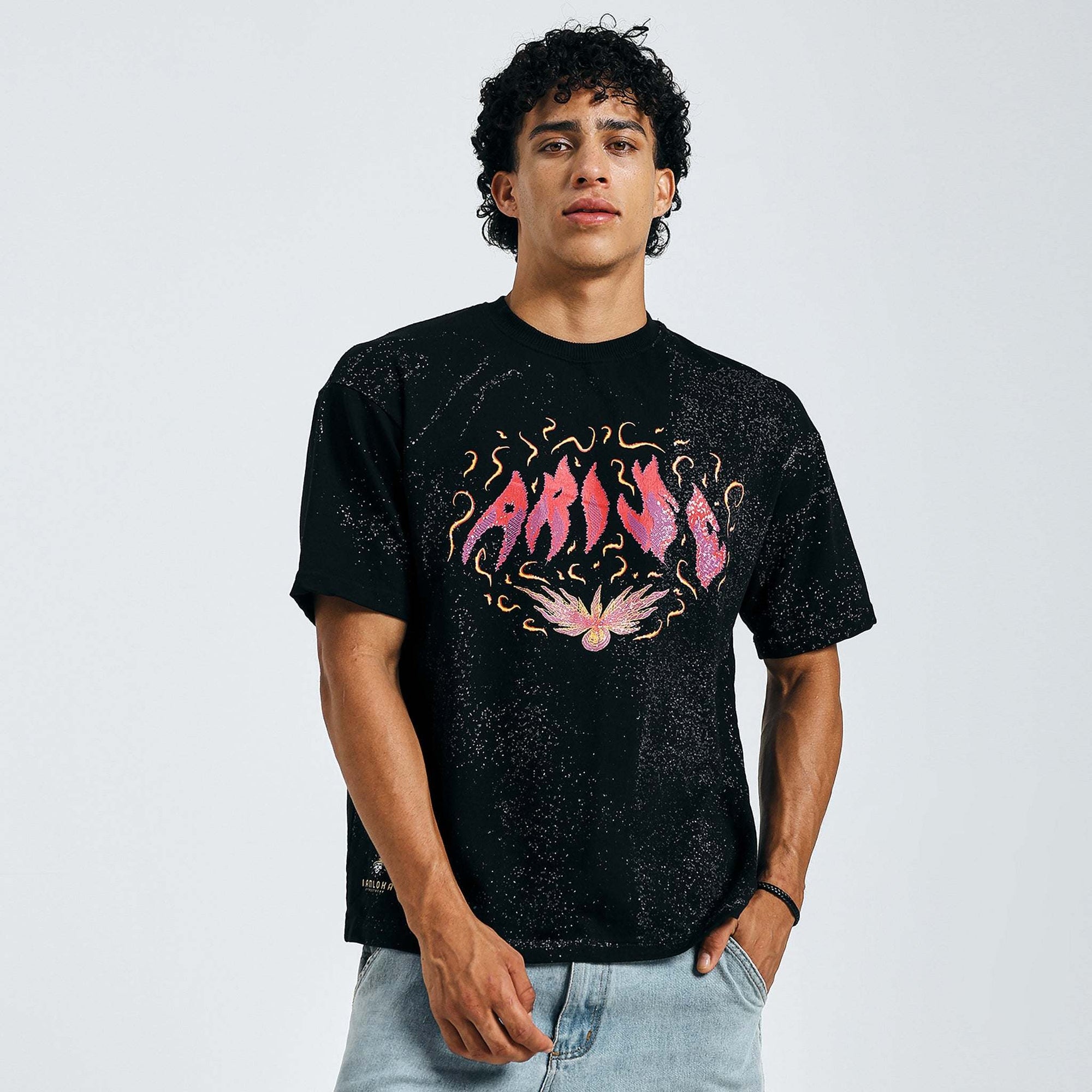 Shop black Arise graphic tee with fiery design, front view, with denim shorts
