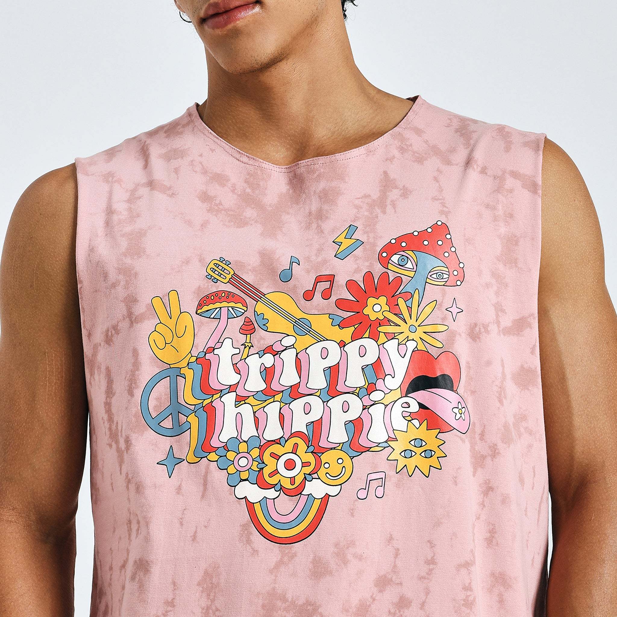 Close-up of pink “Trippy Hippie” tank top with psychedelic graphic design on chest.