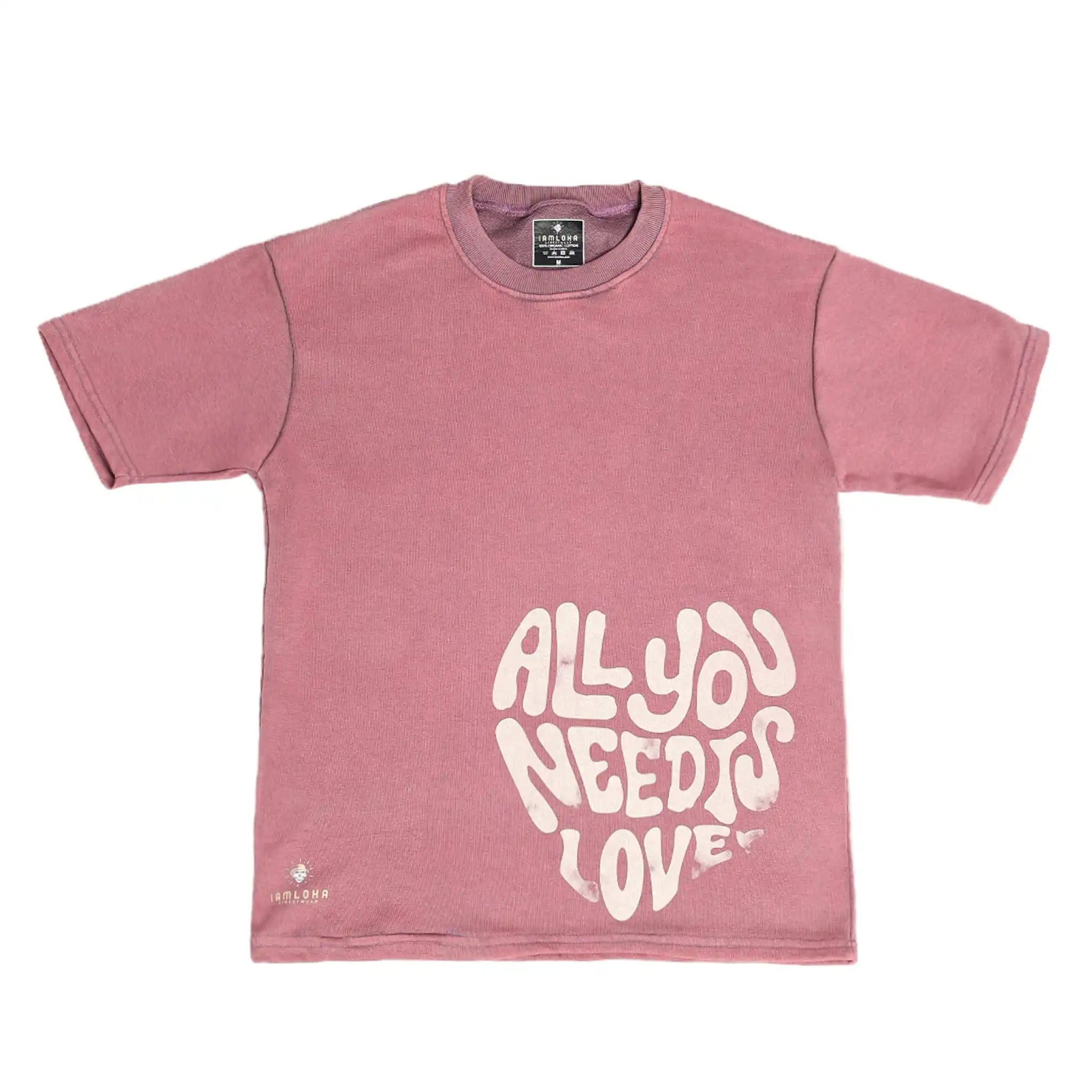 Pink t-shirt with 'All You Need Is Love' text on a white background