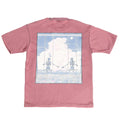 Pink t-shirt with a graphic of two robots on a swing against a clouded sky.