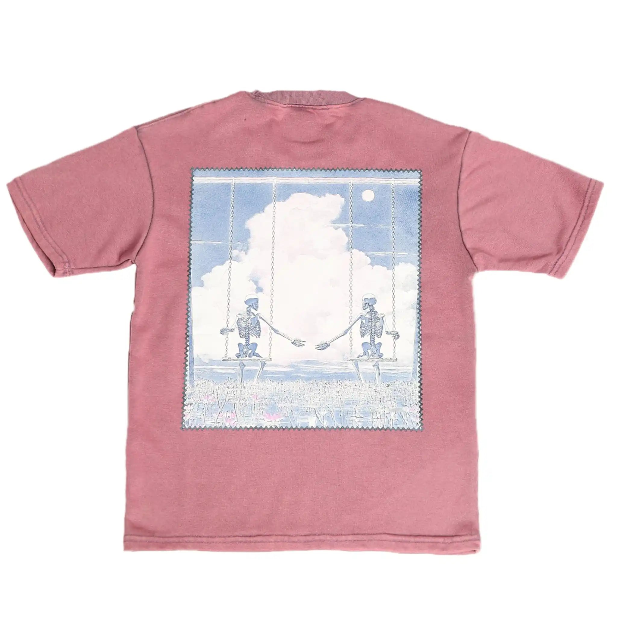 Pink t-shirt with a graphic of two robots on a swing against a clouded sky.