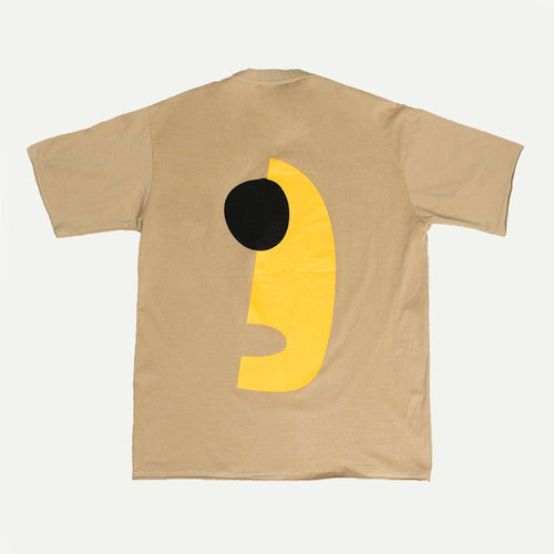 Beige t-shirt with a yellow and black abstract design on a white background