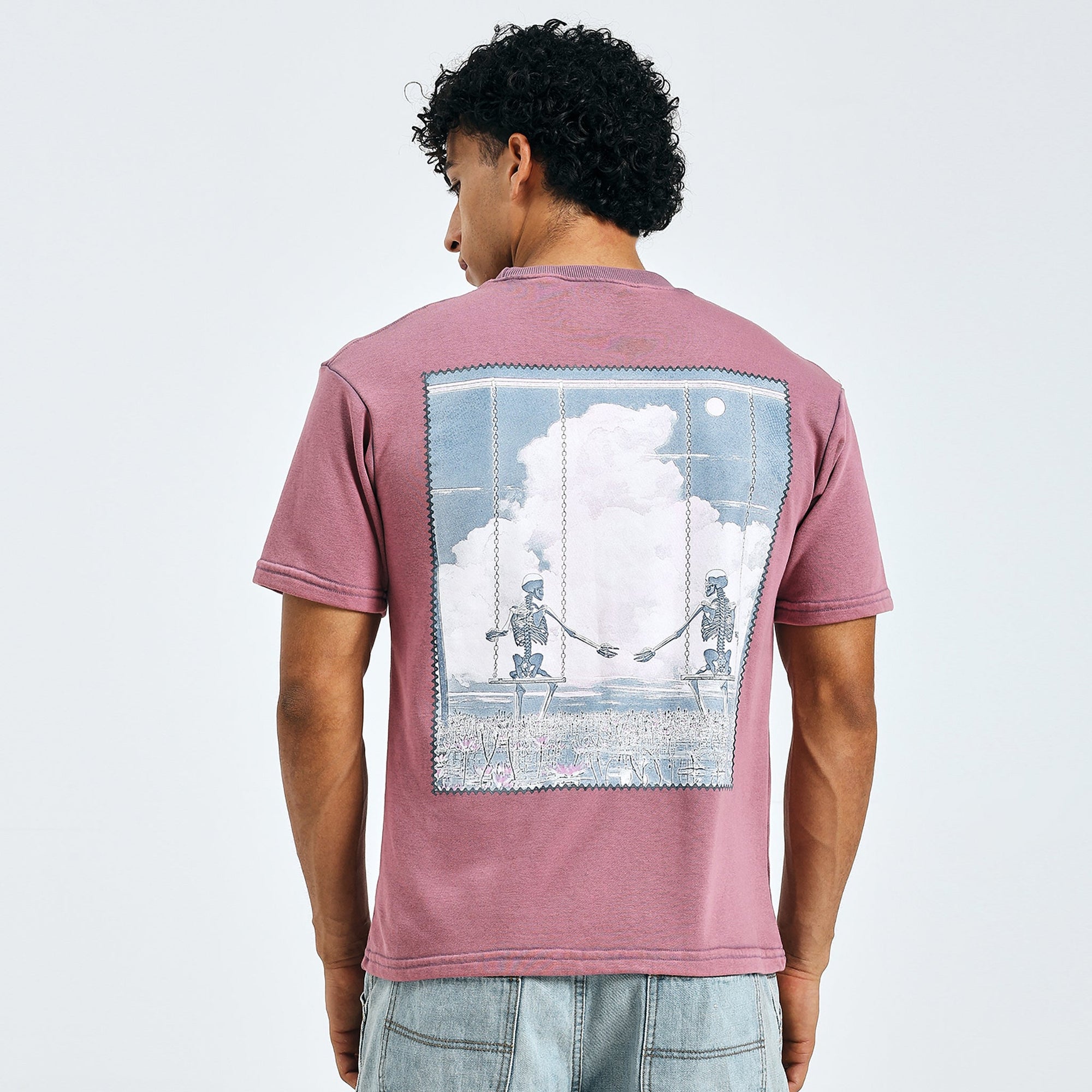 Loka Swing Love Tee in deep pinkish-purple with artistic skeleton design on back, made from 280 GSM cotton terry.
