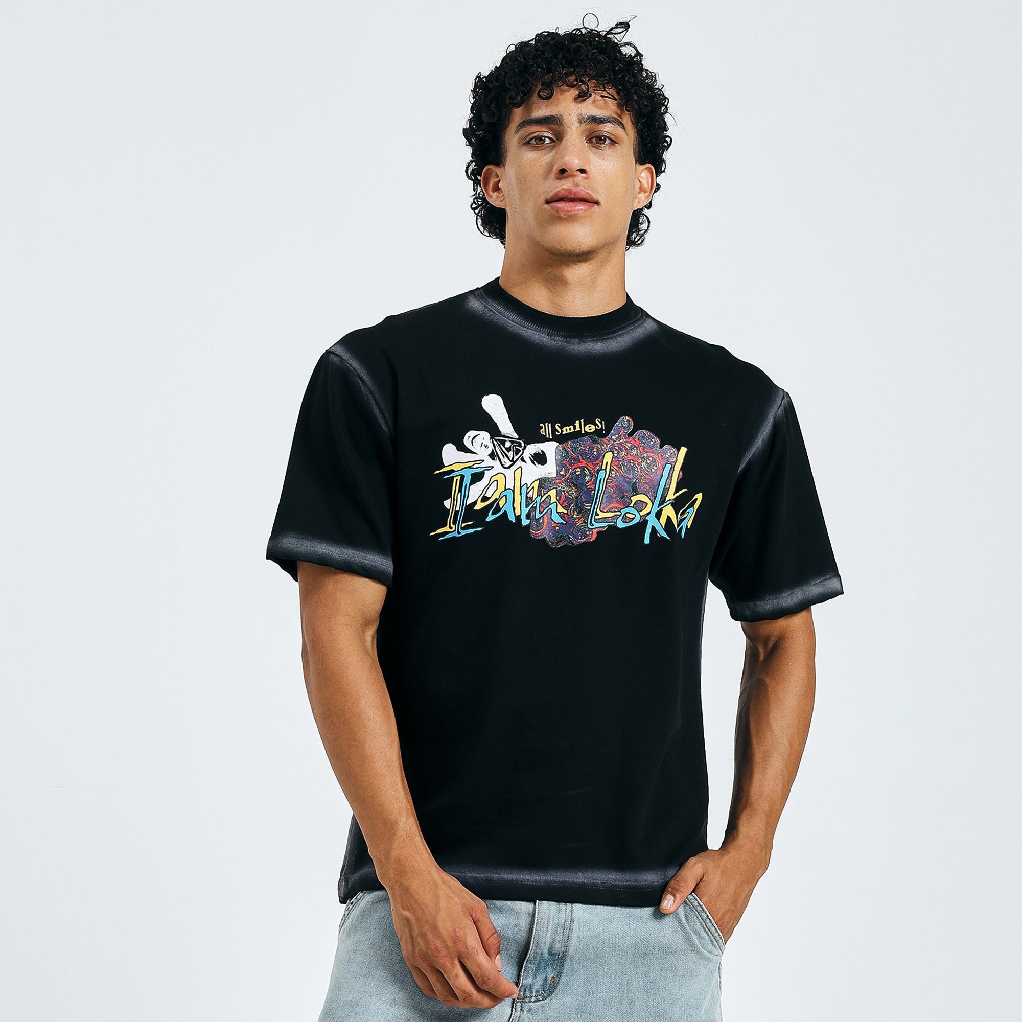 Loka Skull Bloom Tee with multicolored text and skull design on black fabric.