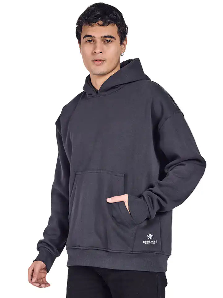 Man wearing a dark gray hoodie with a brand logo on a white background