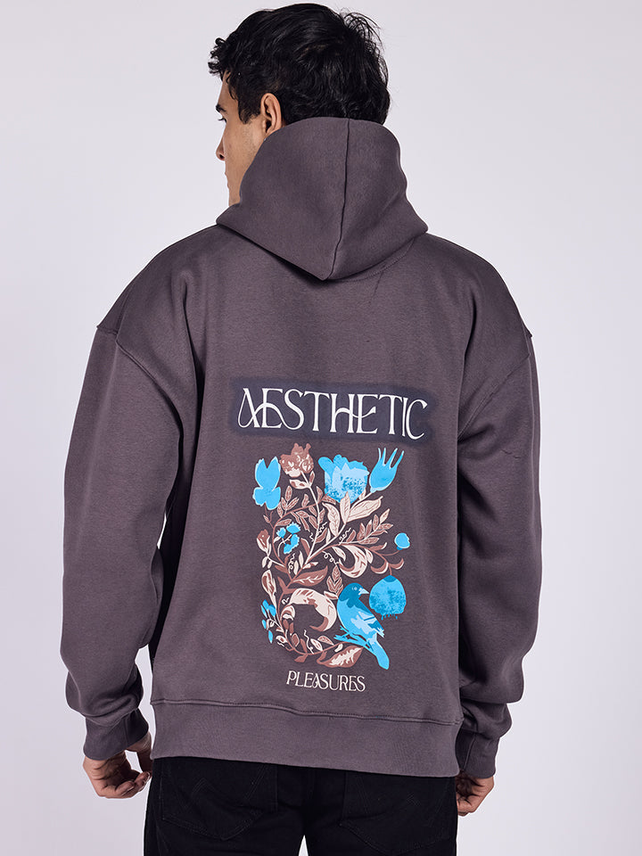 Dark grey aesthetic hoodie with floral art and oversized fit.