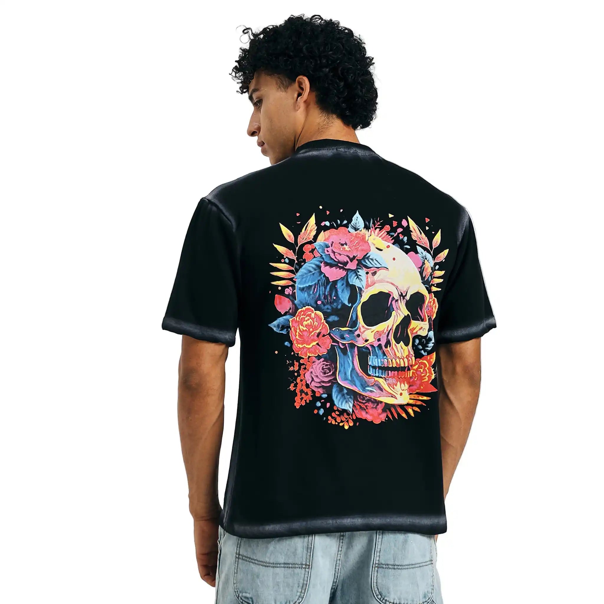 Loka Skull Bloom T-shirt on model in black with graphic design.