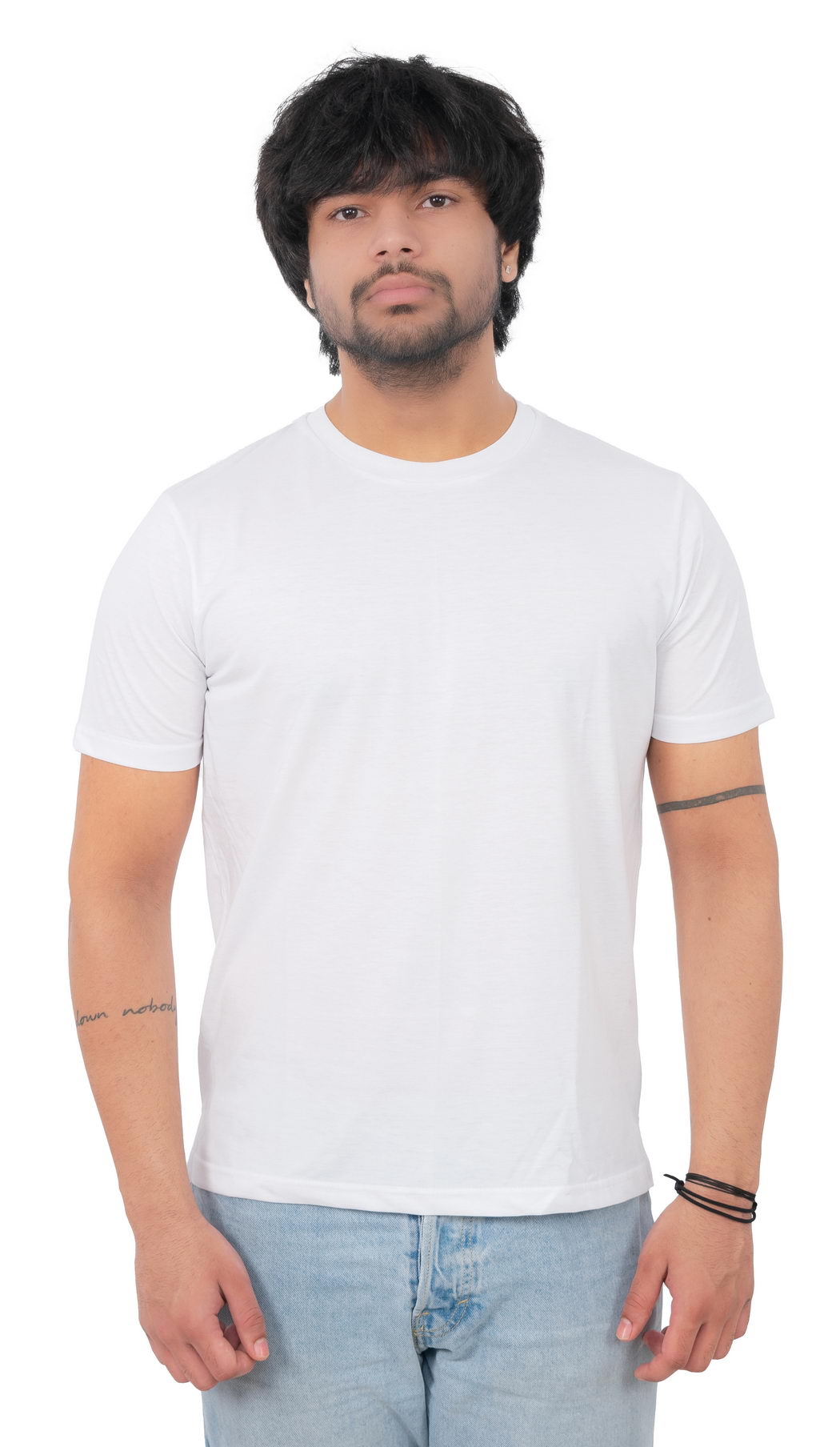 Man wearing a plain white t-shirt and light blue jeans on a white background