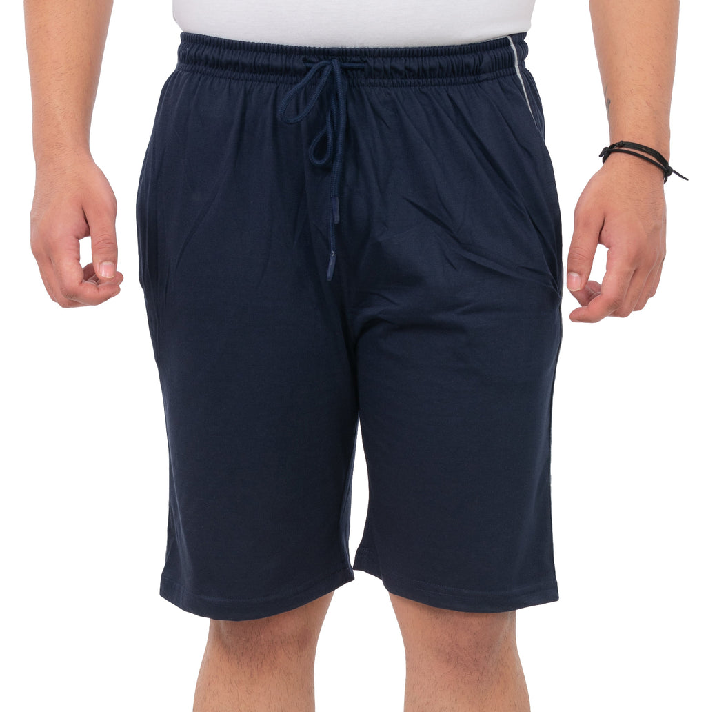 Person wearing navy blue shorts on a white background