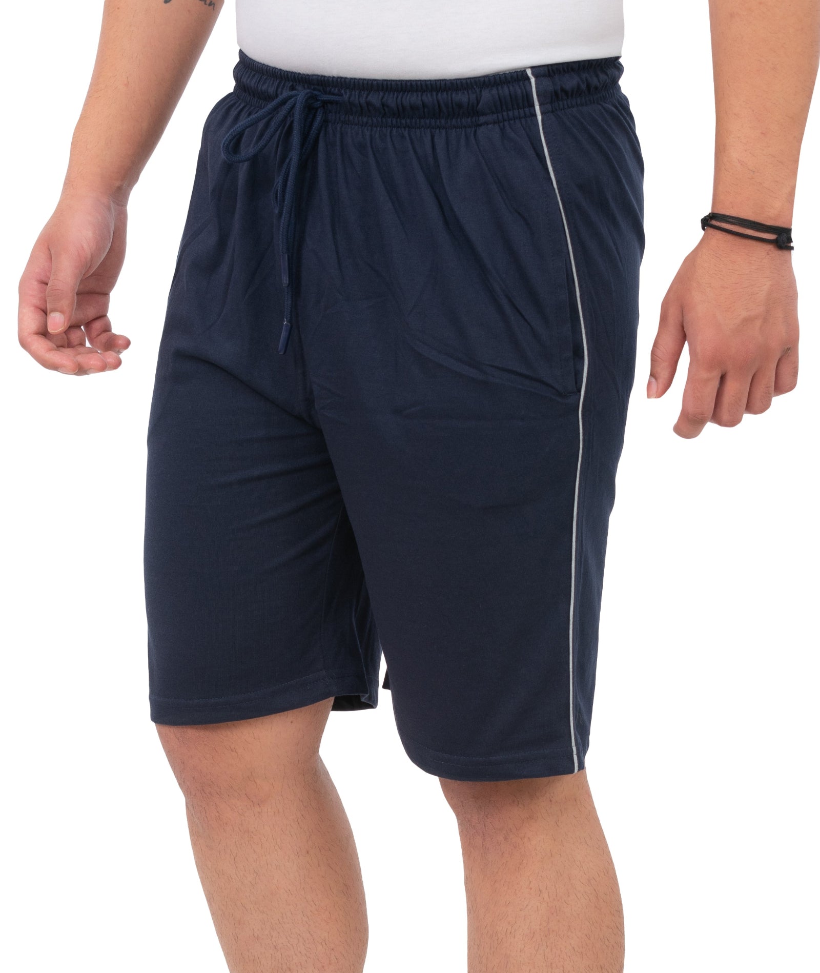 Person wearing navy blue shorts on a white background