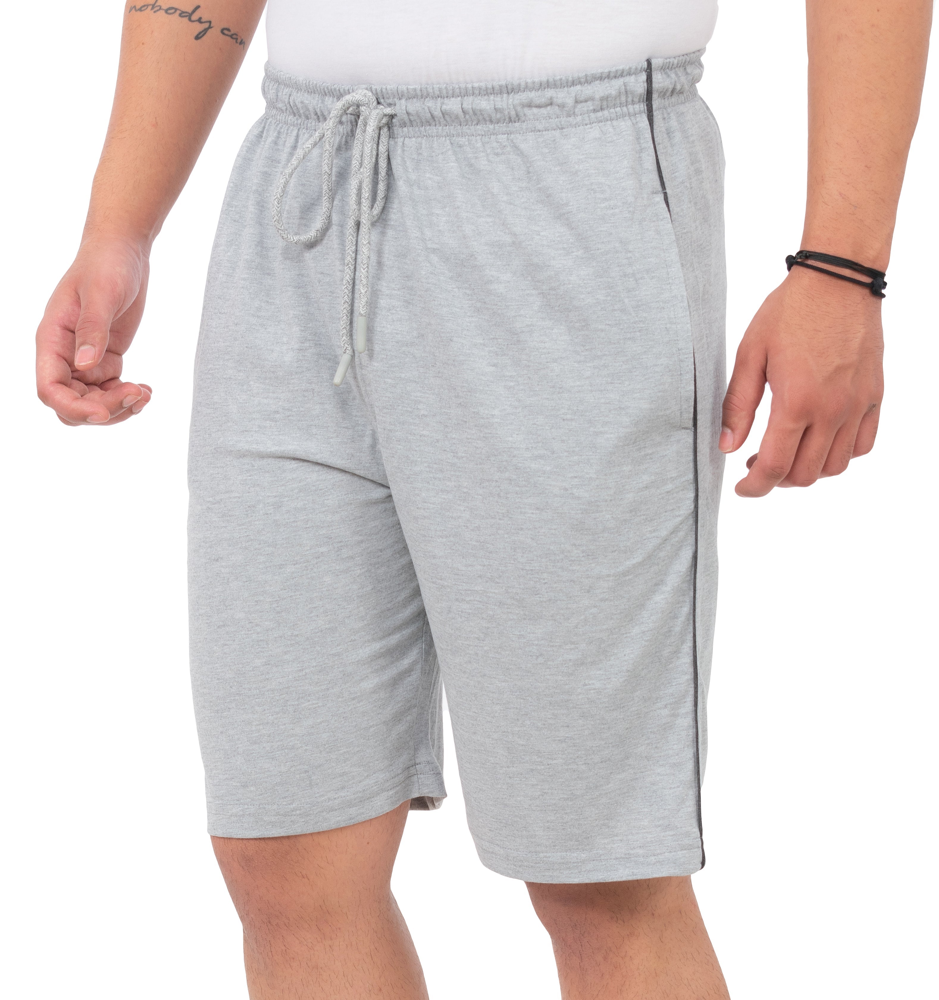 Person wearing gray shorts on a white background