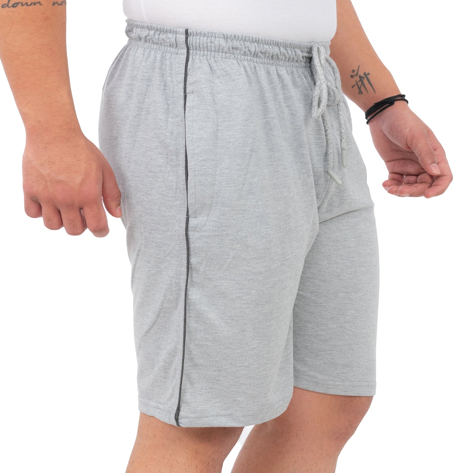 Person wearing gray shorts on a white background