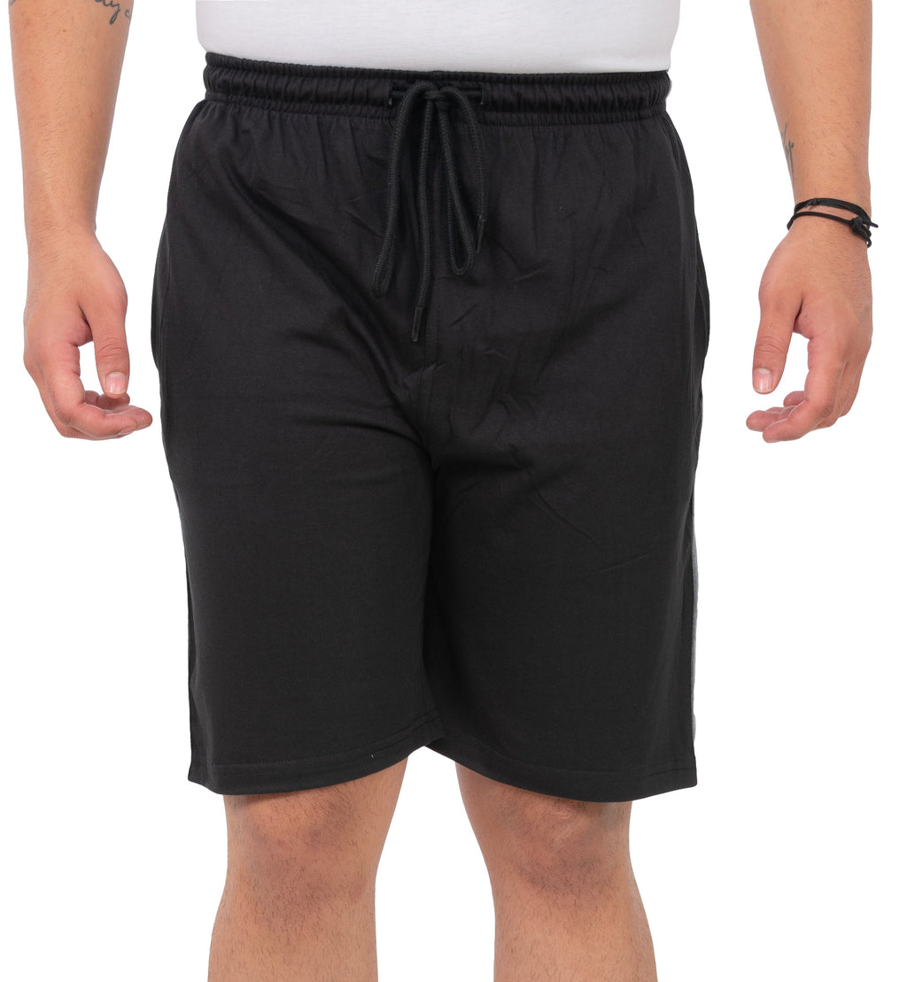 Person wearing black shorts on a white background
