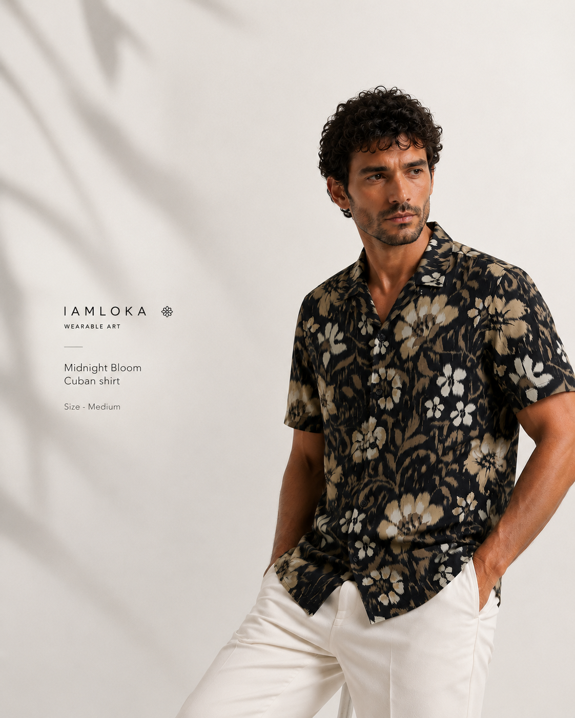 Man wearing a floral shirt with 'IAMLOKA' branding on a light gray background