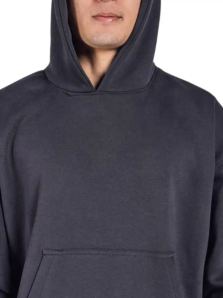 charcoal oversized hoodie with colorful abstract design on the back against a white background