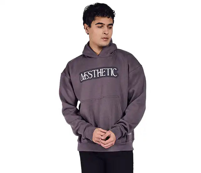 A dark grey oversized hoodie with aesthetic art screen printed on the front and back.
