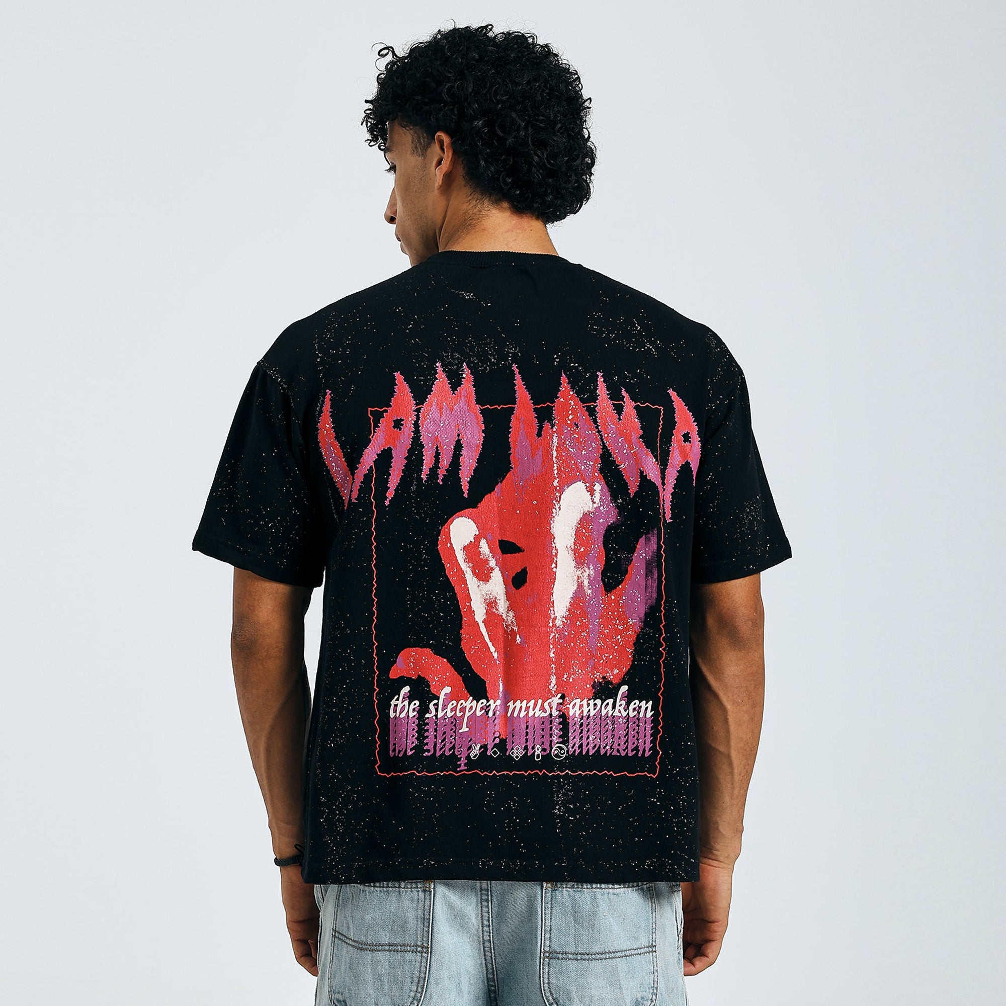 Buy black Arise tee with "The Sleeper Must Awaken" text, back view, on model.