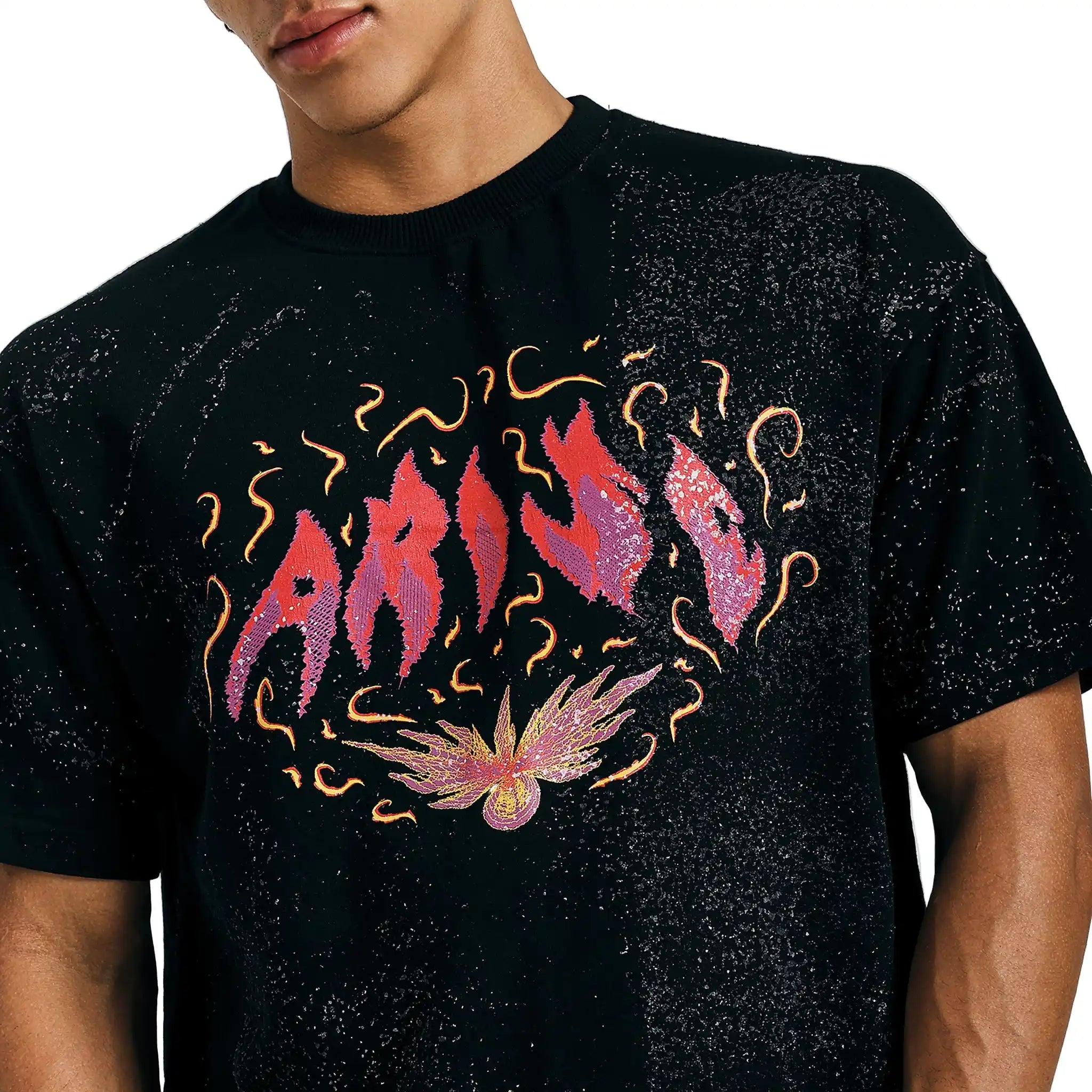 Close-up of black Arise graphic tee with fiery psychedelic design on chest