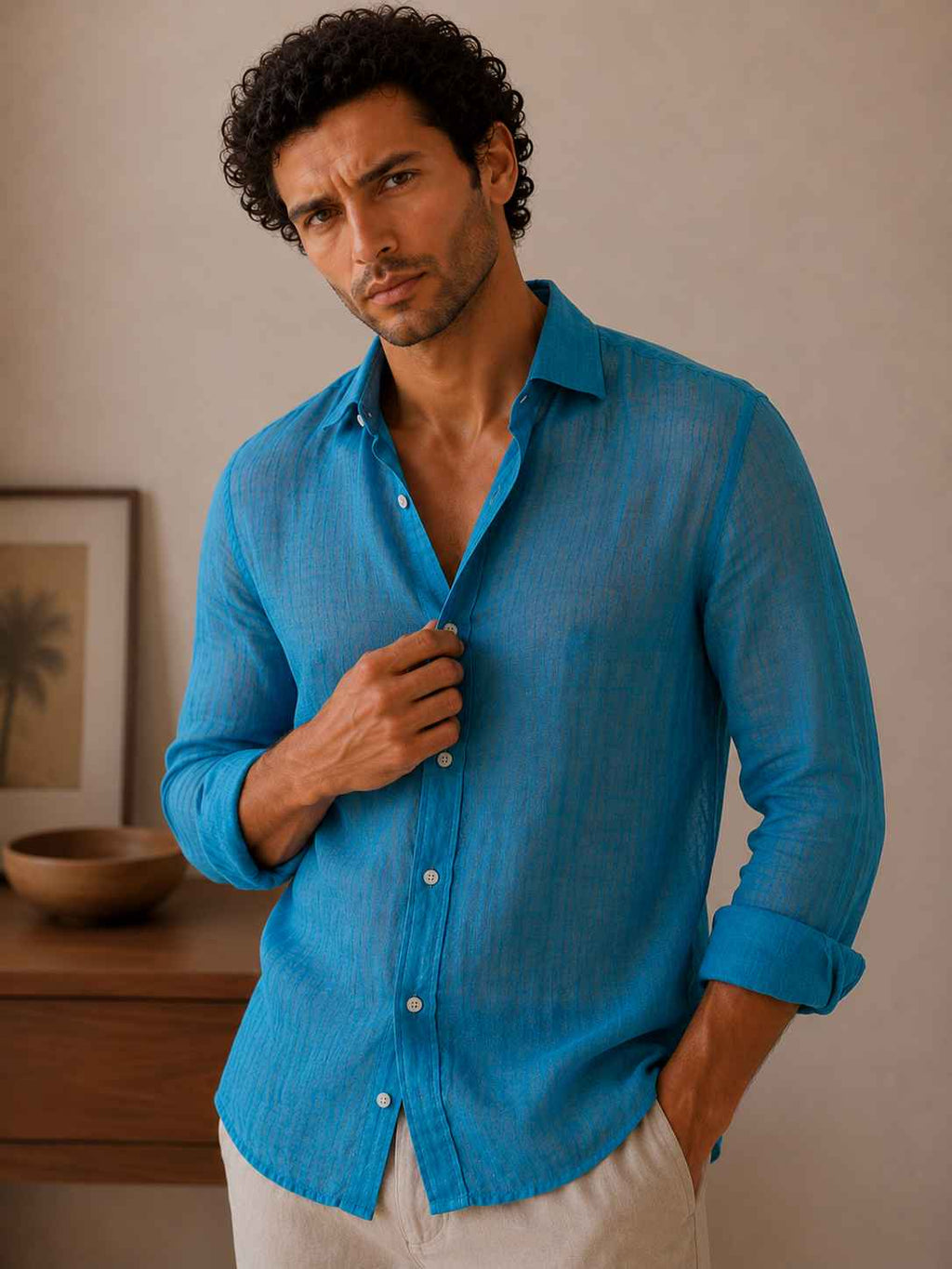 Man wearing a blue shirt in an indoor setting